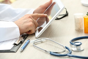 bigstock Doctor working at table in off 106896050